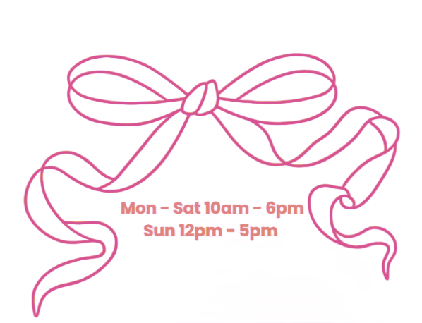 Pink ribbon bow with store hours: Mon-Sat 10am-6pm, Sun 12pm-5pm.