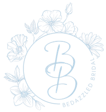 Gold "BB" calligraphy within a floral wreath; "Bedazzled Bridal" text in blue.