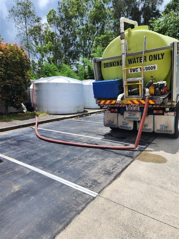 Pipe Running Water Into Water Tank  — Hinterland Water Cartage in Mooloolah Valley, QLD