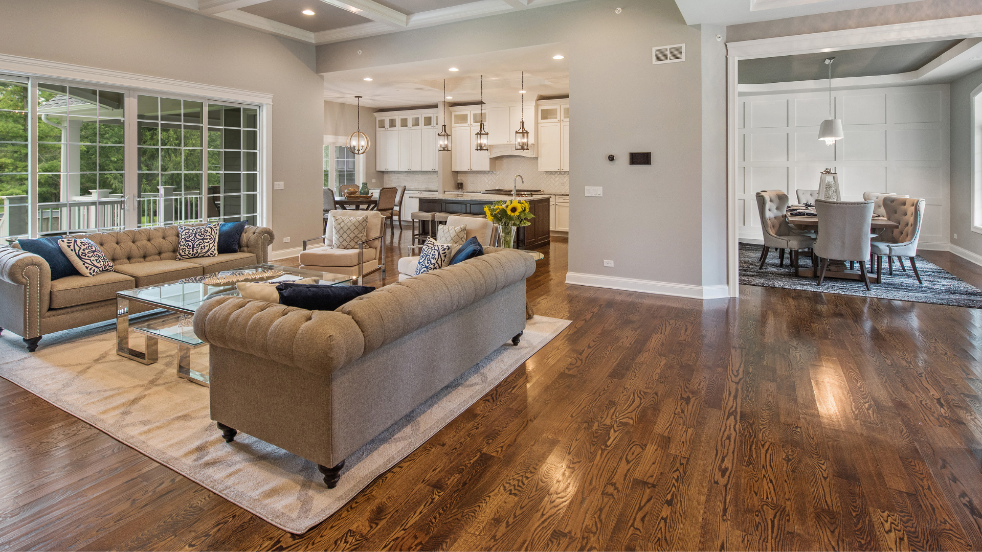 It is a living room with hardwood floors and a couch.