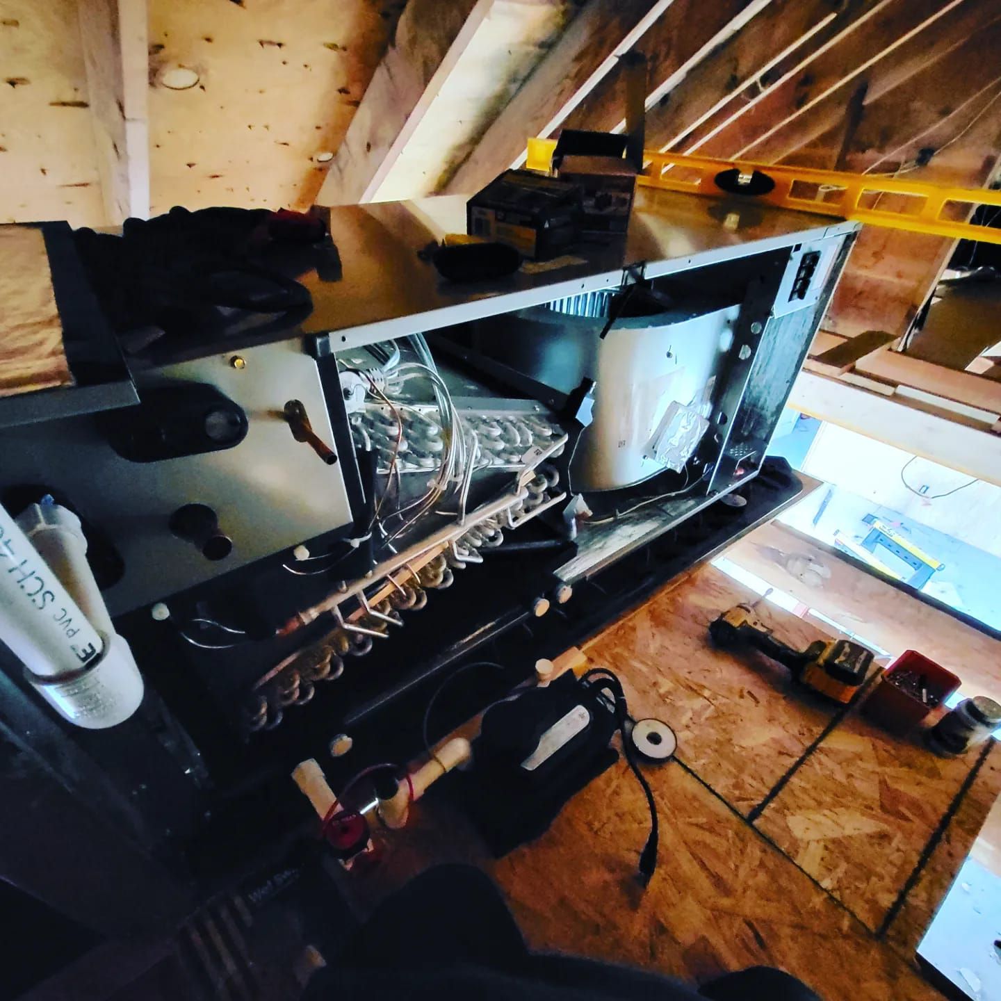 A saxophone is sitting on top of a table in a room.