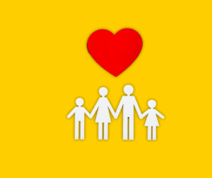Family silhouette holding hands with a red heart above them on a yellow background.
