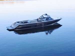 Boat floating on calm water.
