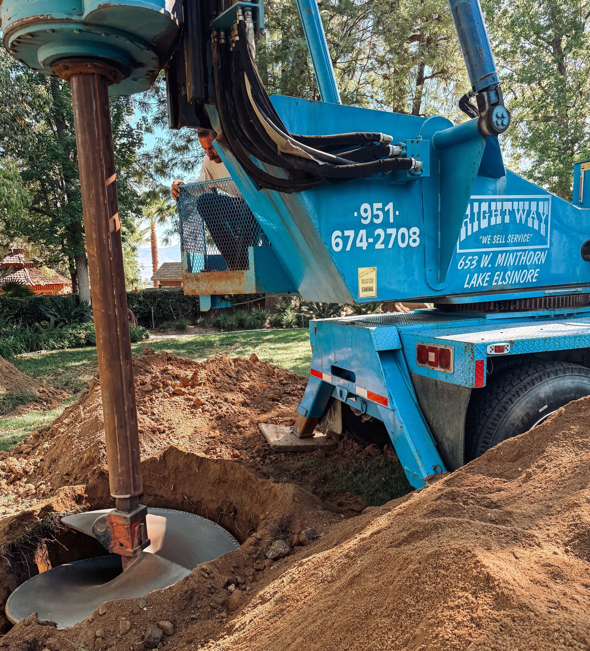 Drill drilling a seepage pit