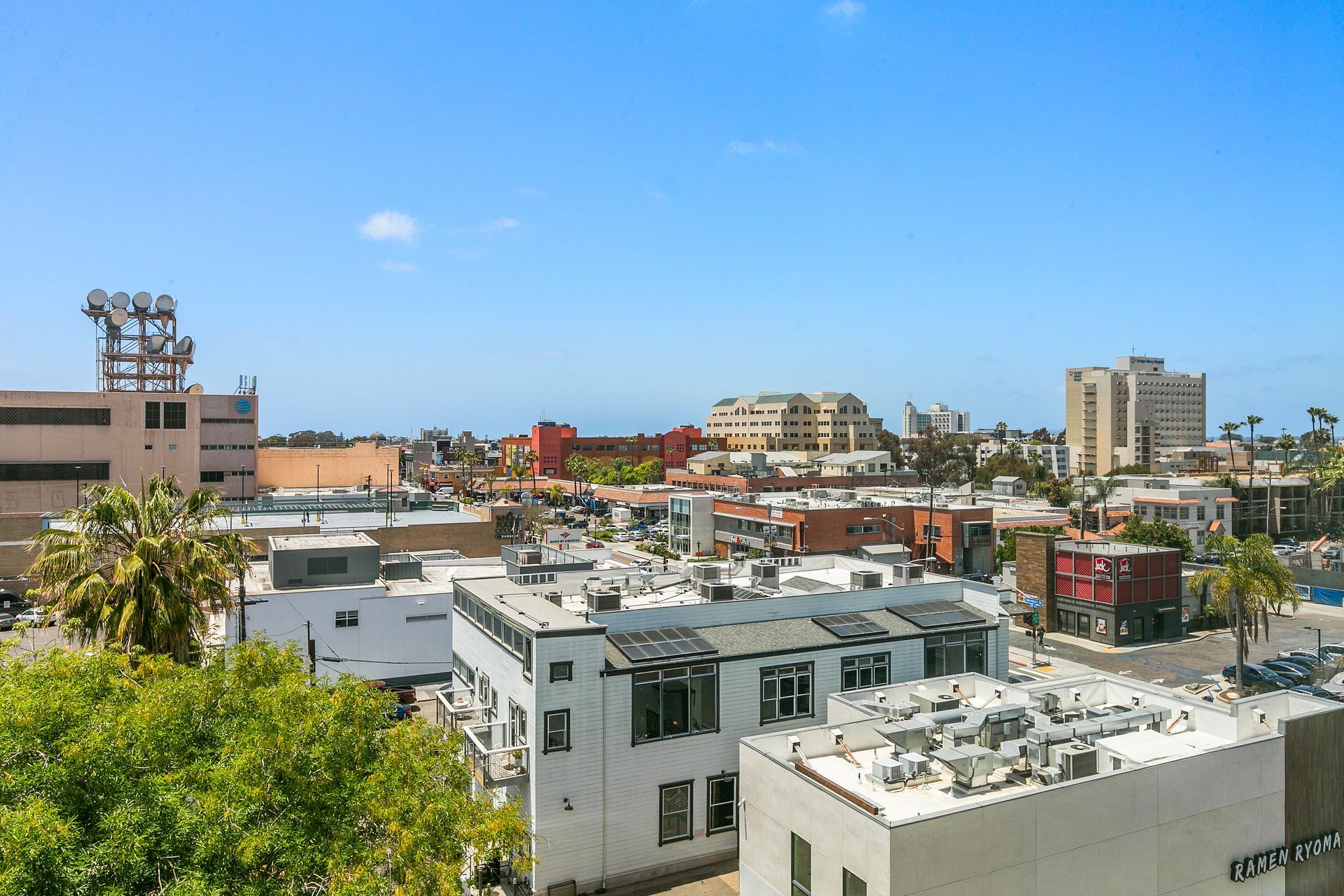 An aerial view of a city with lots of buildings and trees