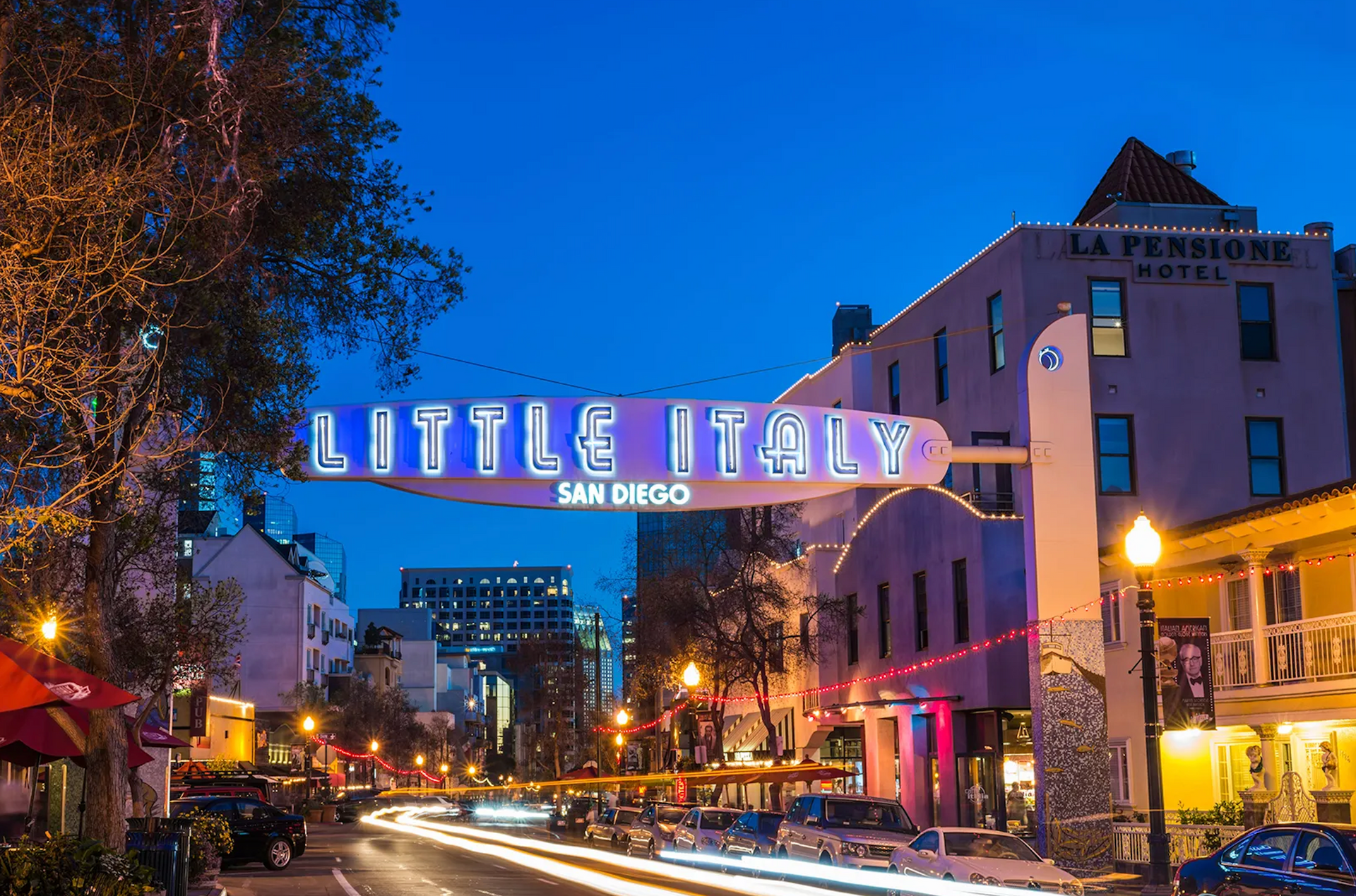 A street with a sign that says little italy on it