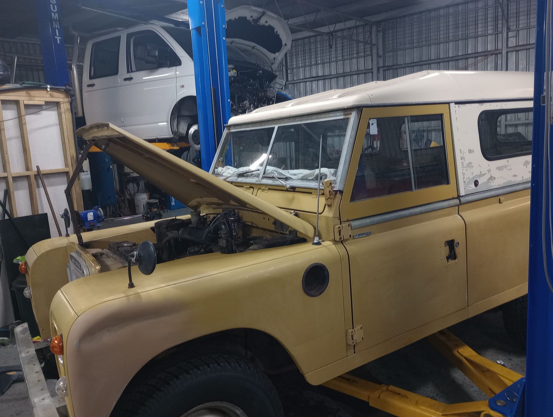 a Vintage Yellow Land Rover With Its Hood Open — Coopers Auto Care in South Lismore, NSW