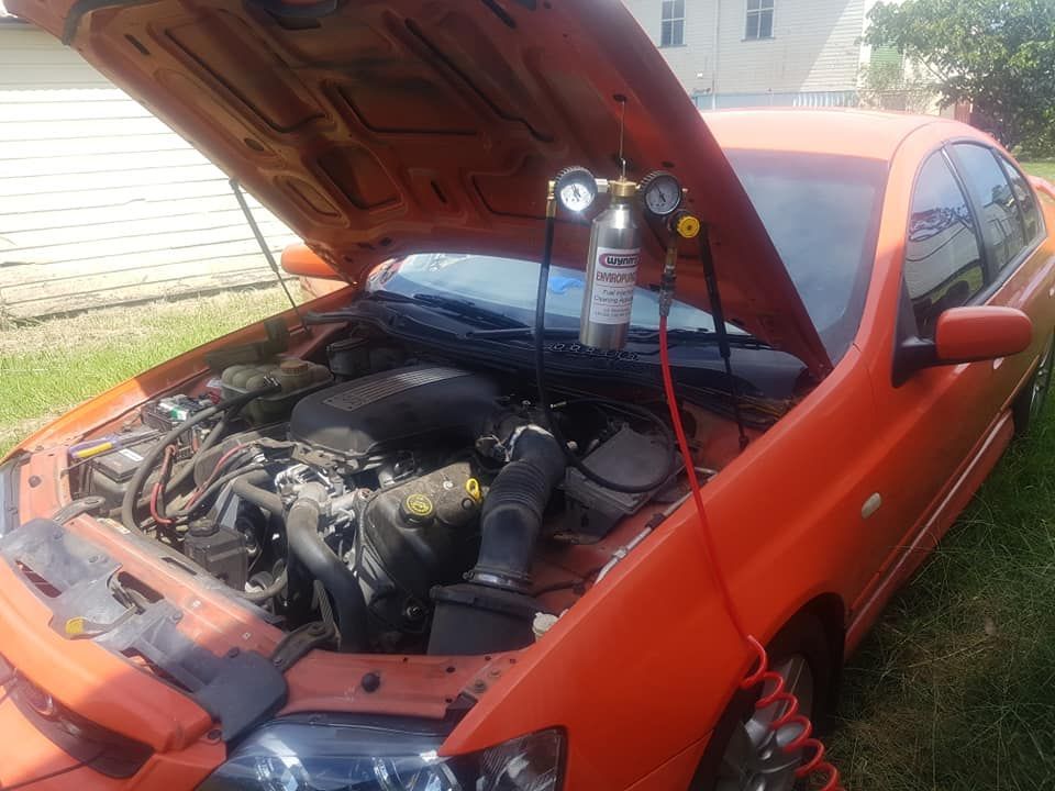 Orange Car With Open Hood — Coopers Auto Care in South Lismore, NSW