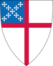 White shield with a red cross and a blue canton filled with white crosses.