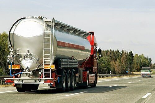 Water Tanker — Truck with Big Water Tank in the Highway in Manchester, CT