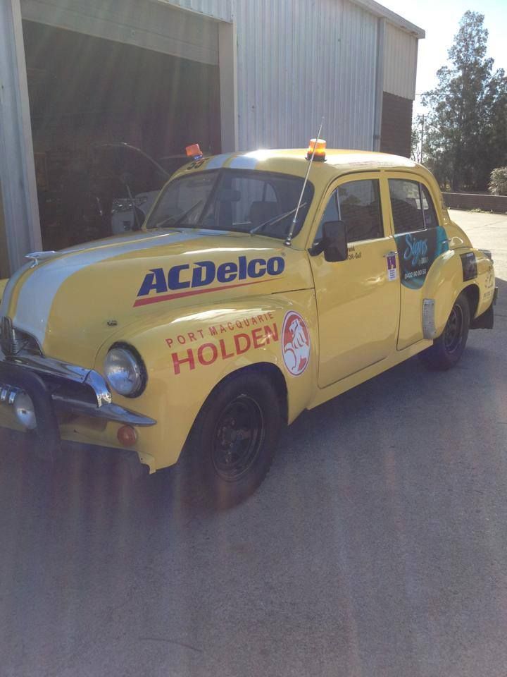 A Yellow Acdelco Holden Car Is Parked In Front Of A Garage — All Port Smash Repairs in Port Macquarie, NSW
