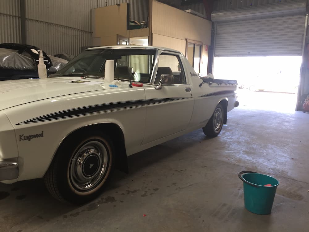 White Vintage Car Inside the Shed — Panel Beating & Restoration Services in Port Macquarie, NSW