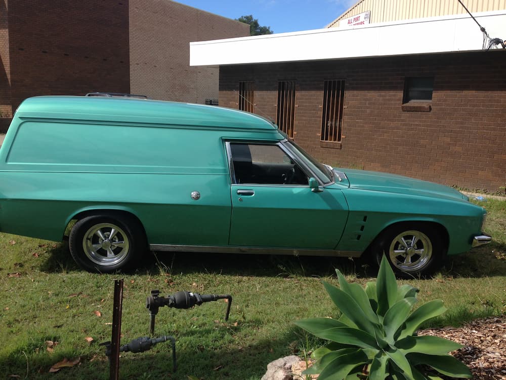Green Car Side View — Panel Beating & Restoration Services in Port Macquarie, NSW