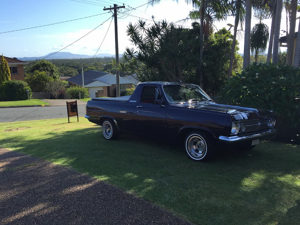 Blue Car Parked in the Road Side — Panel Beating & Restoration Services in Port Macquarie, NSW