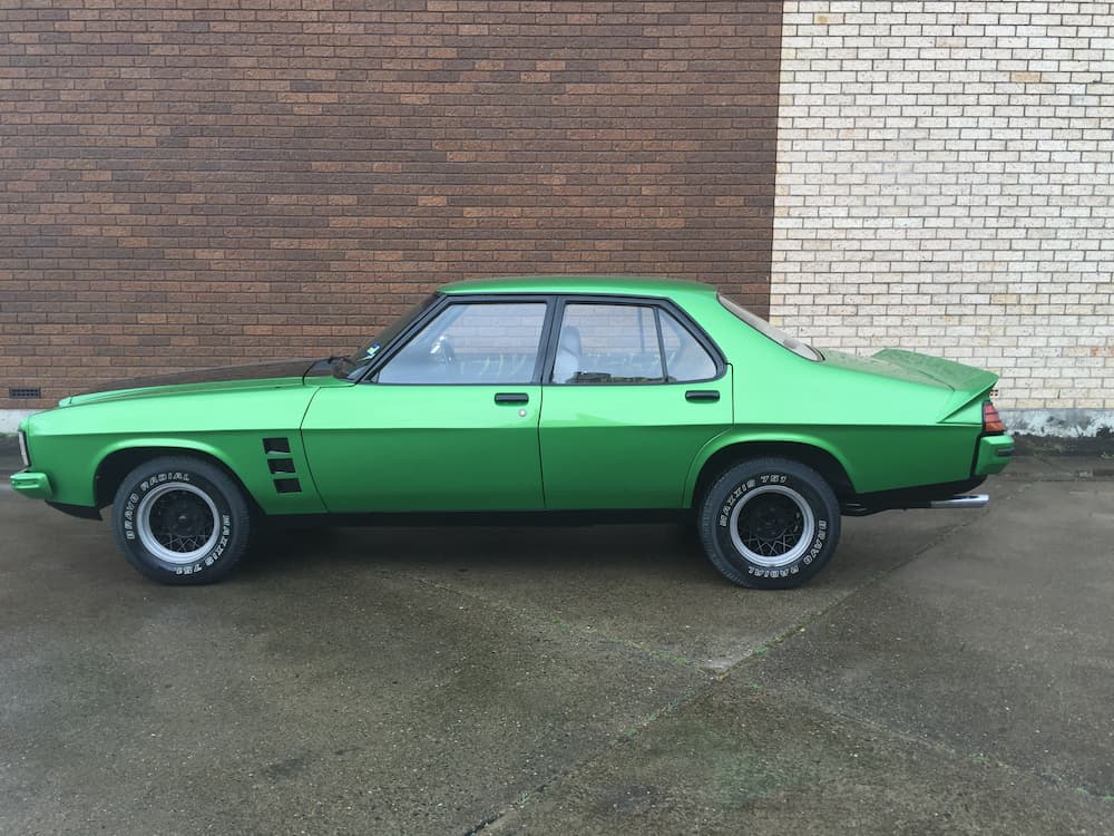 Metallic Green Car — Panel Beating & Restoration Services in Port Macquarie, NSW