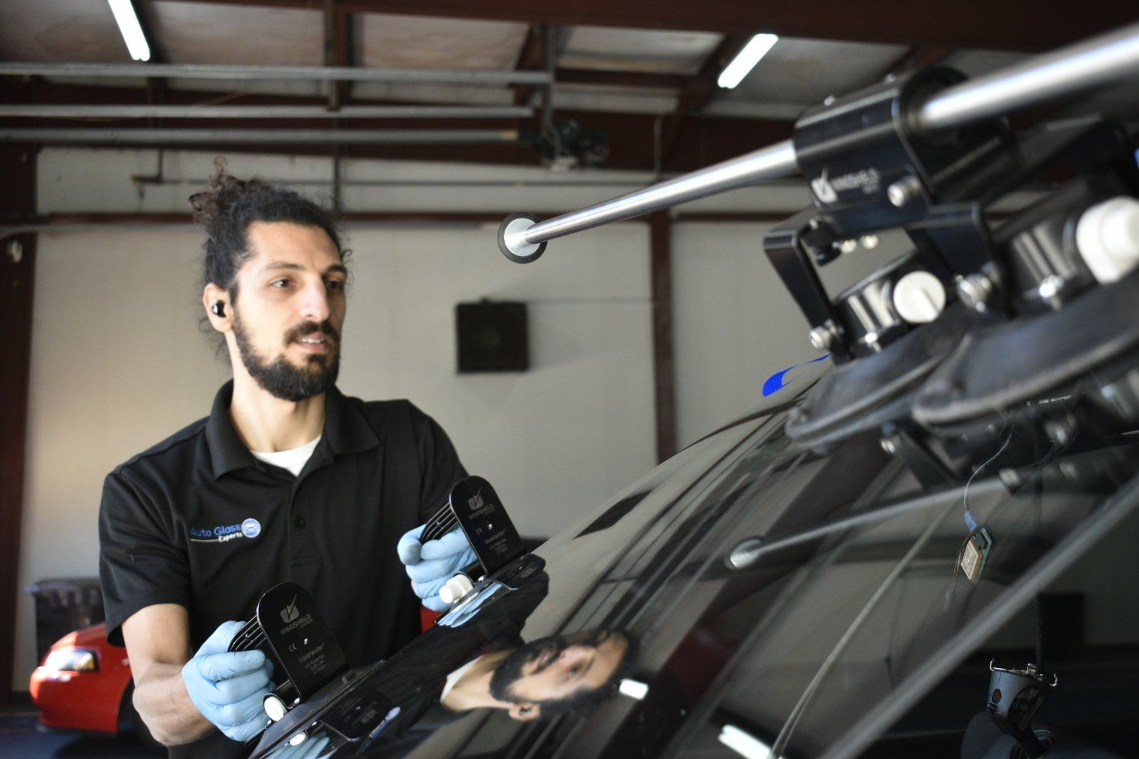 Man Replacing the Windshield – Windshield Replacement Services Charlotte NC