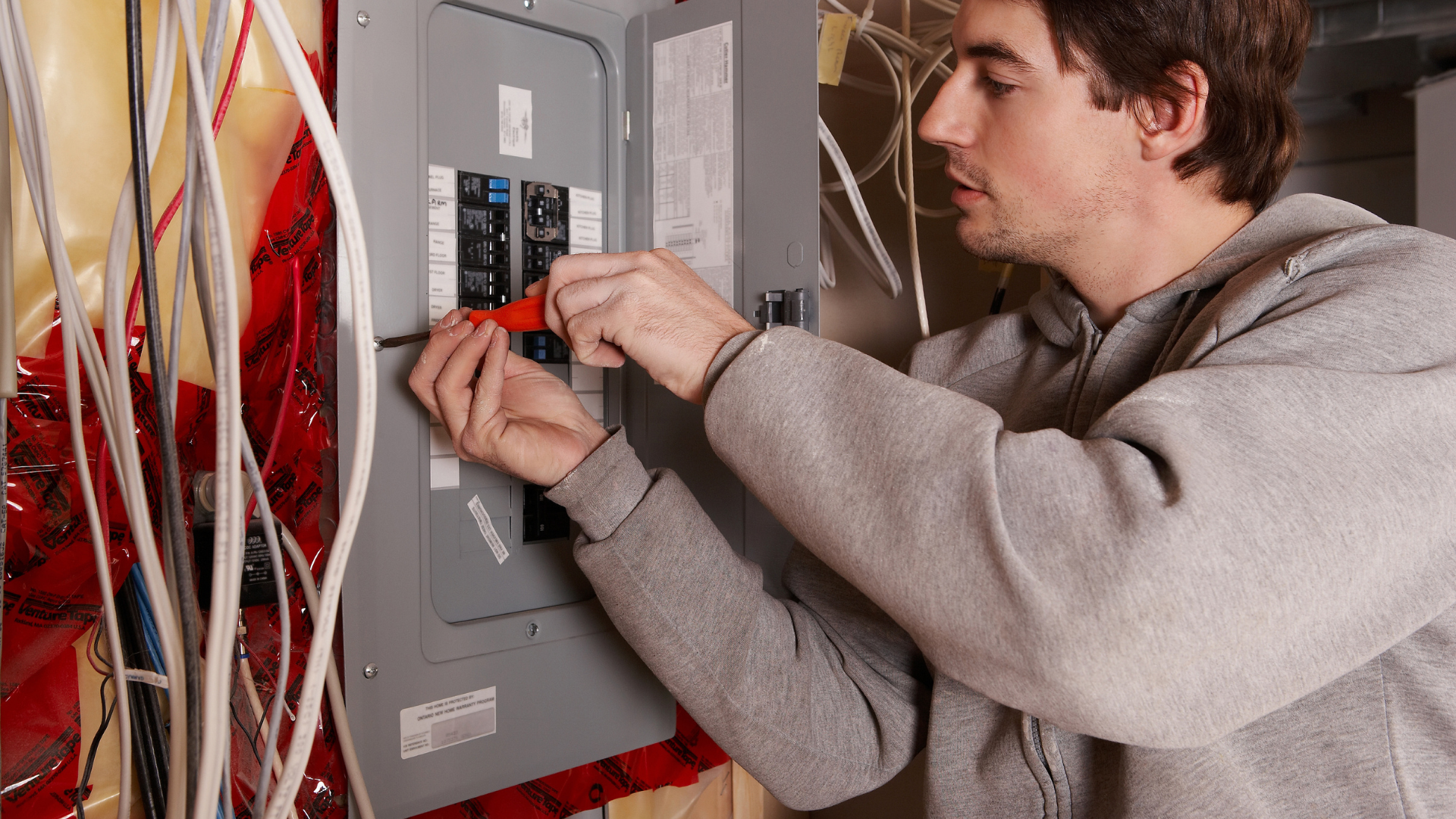 Man working on an electrical panel