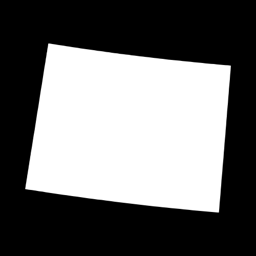 A white piece of paper is sitting on a black surface.