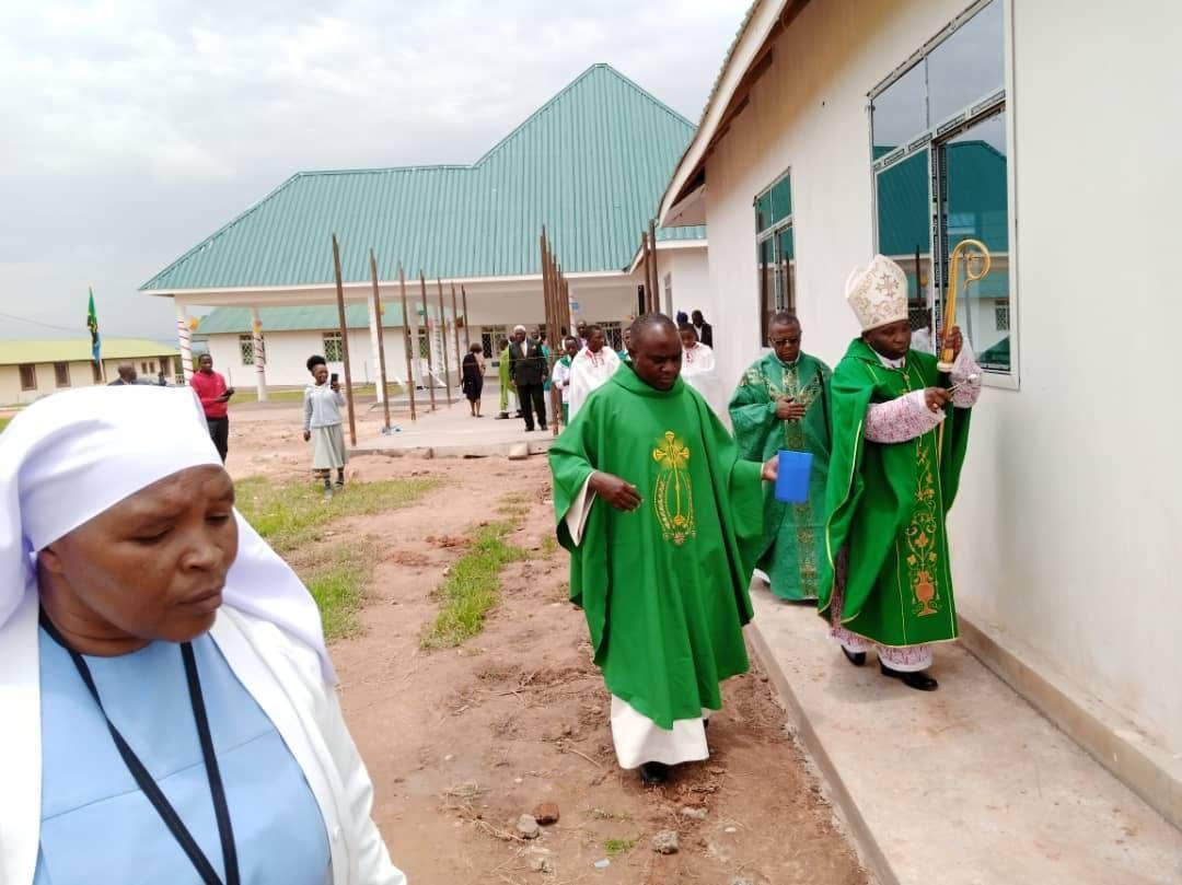 Father Nestor and Bishop blessing the new Inuka building