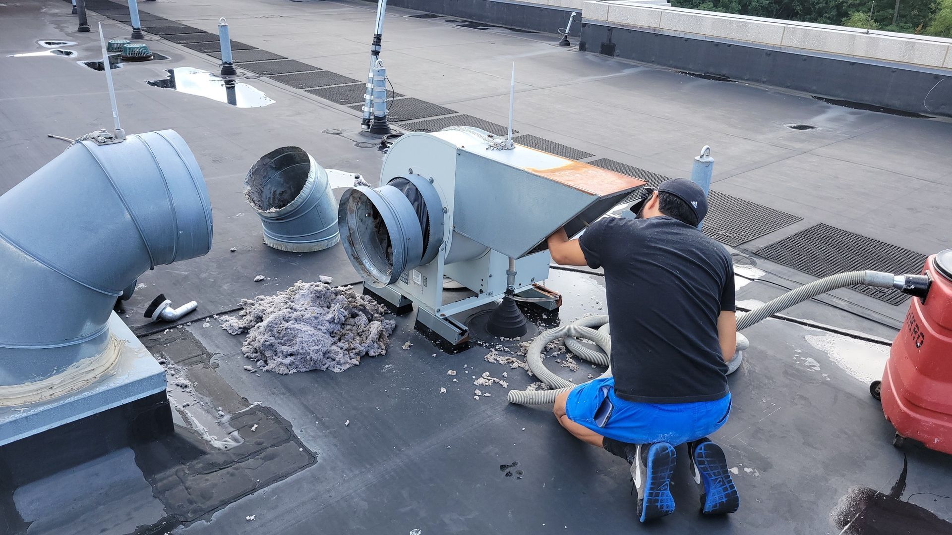 Man Cleaning A Vent — Springfield, MA — Advanced Air Quality, Inc.