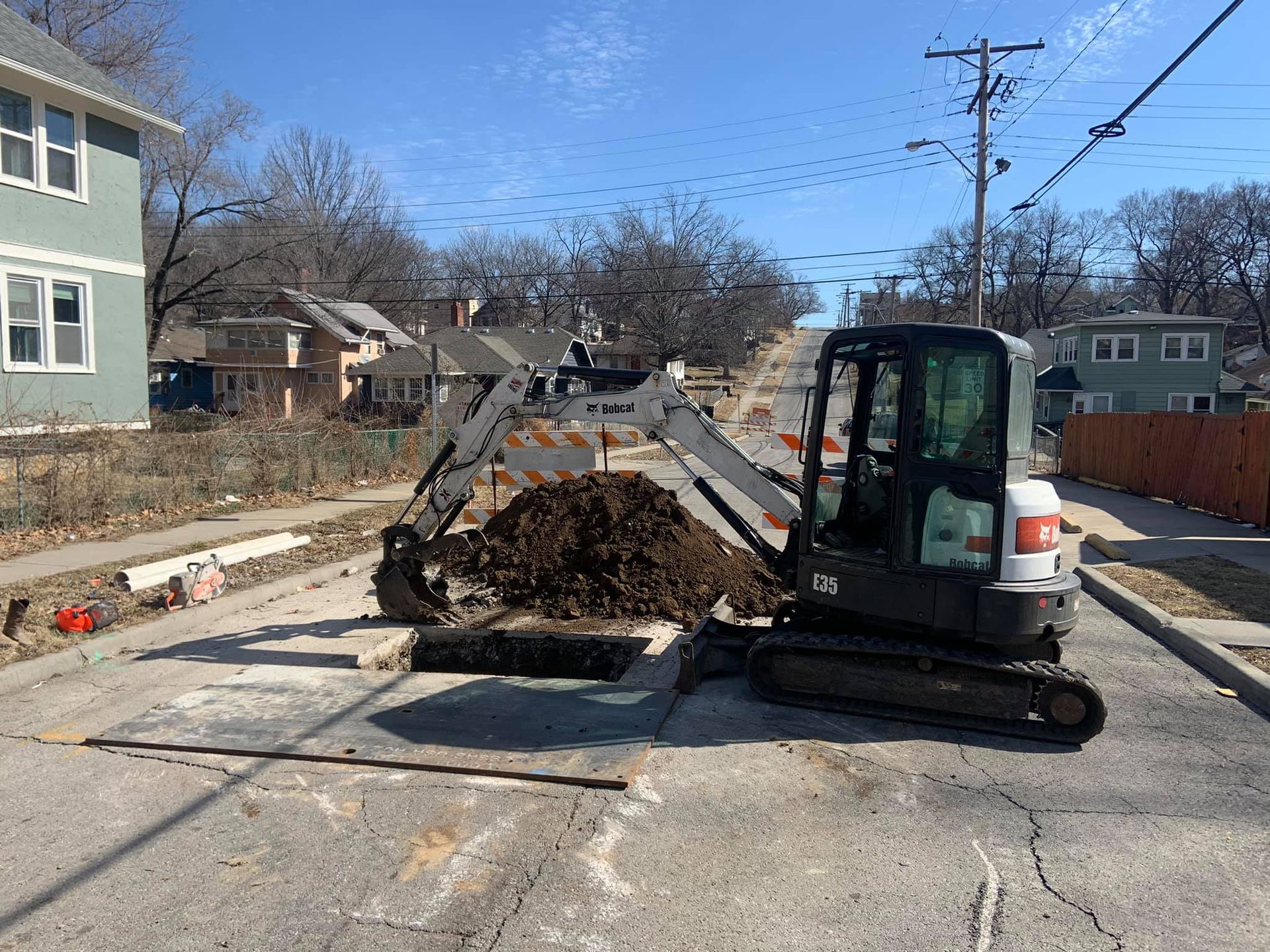 An excavator in the middle of the road