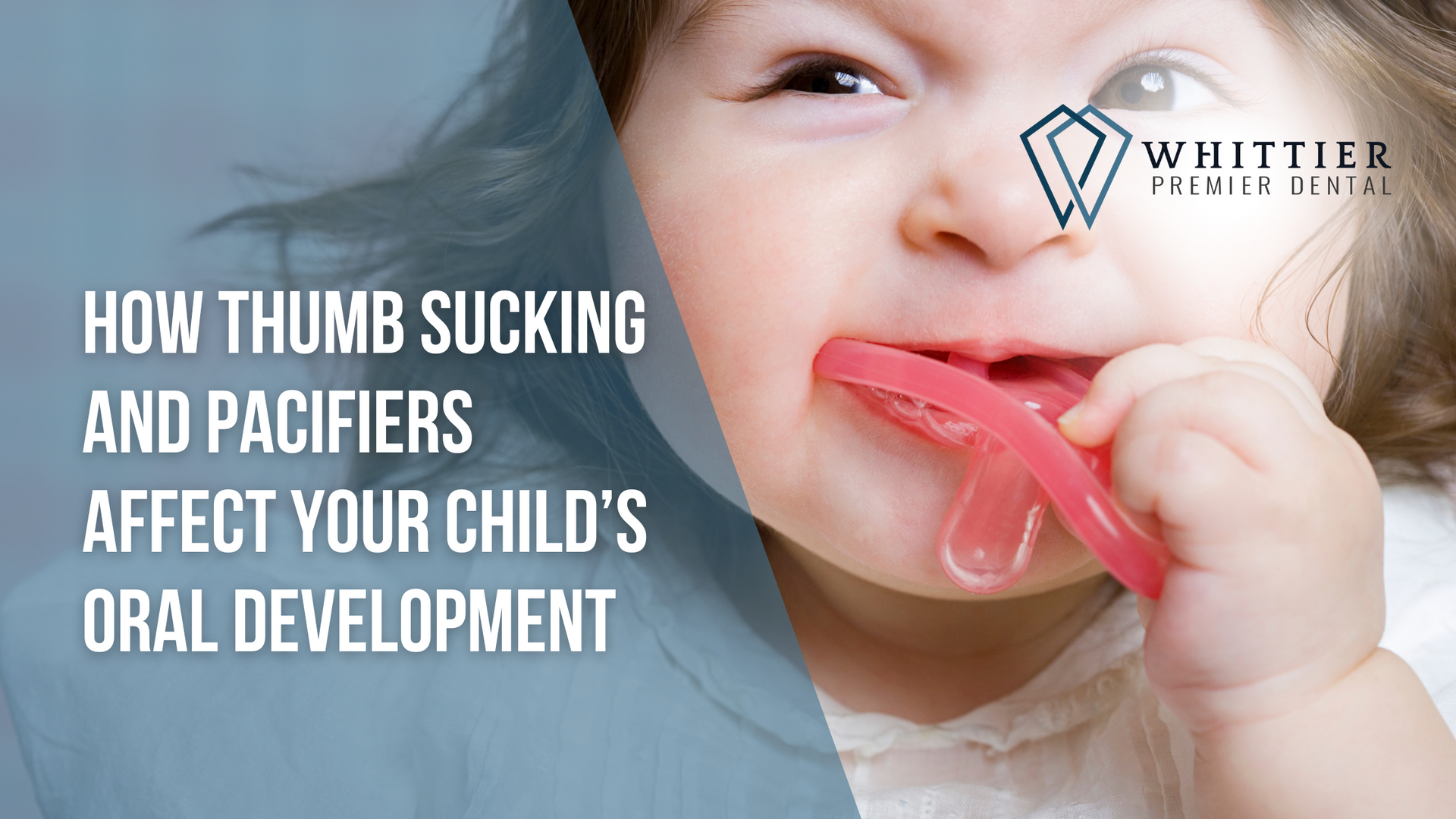 a baby is chewing on a pacifier .