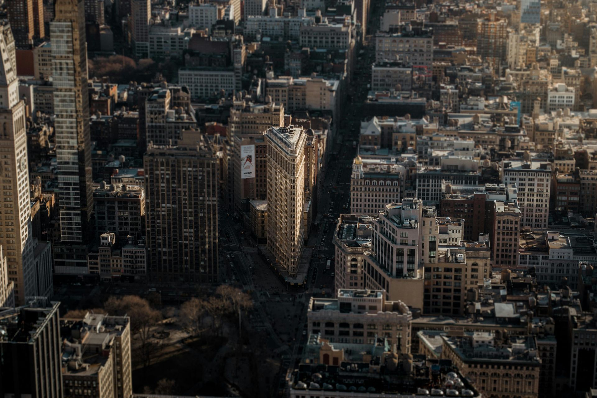 An aerial view of a city with lots of tall buildings.