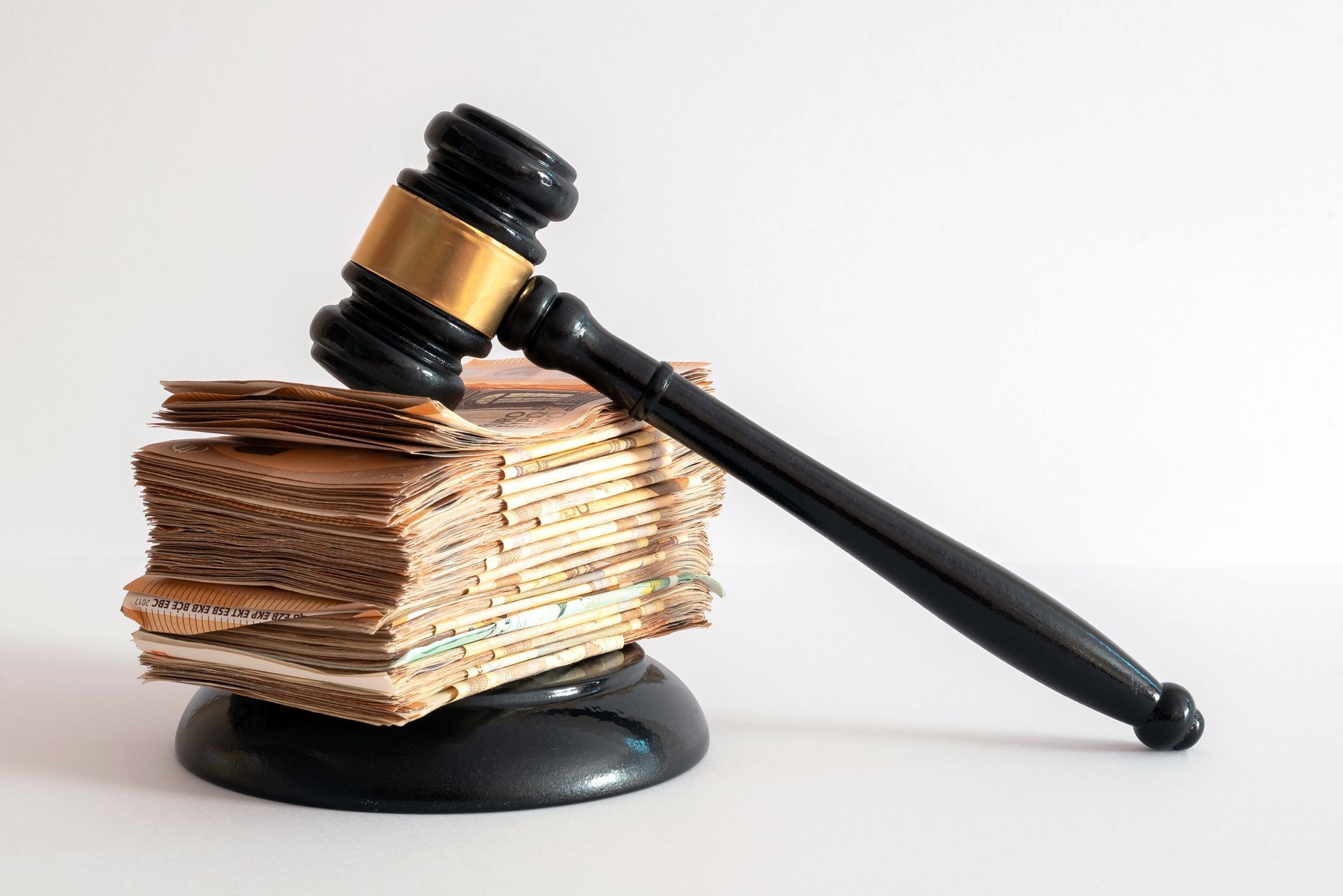 A judge's gavel is sitting on top of a pile of cardboard.