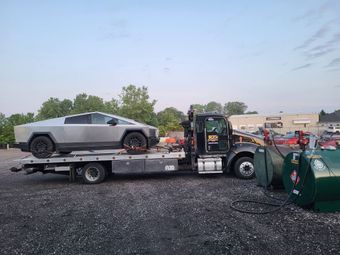 Flatbed towing of a Tesla Cybertruck by VJ's Towing & Rescue in Perrysburg, OH. Located at 26725 Eckel Rd, Perrysburg, OH 43551. Call (419) 874-3251 for trusted towing.