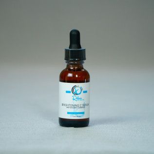 Amber glass bottle of Brightening C Serum with dropper.