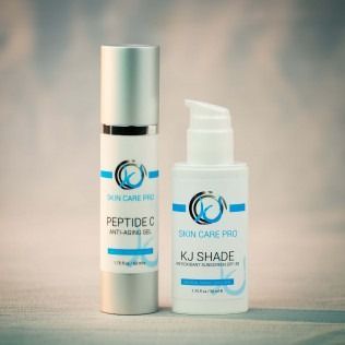 Two cosmetic product bottles: Peptide C and KJ Shade, in front of a blurred background.