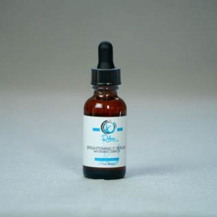 Amber glass dropper bottle of brightening serum.