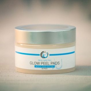 Jar of Glow Peel Pads skincare product. Light tan jar with a silver lid.