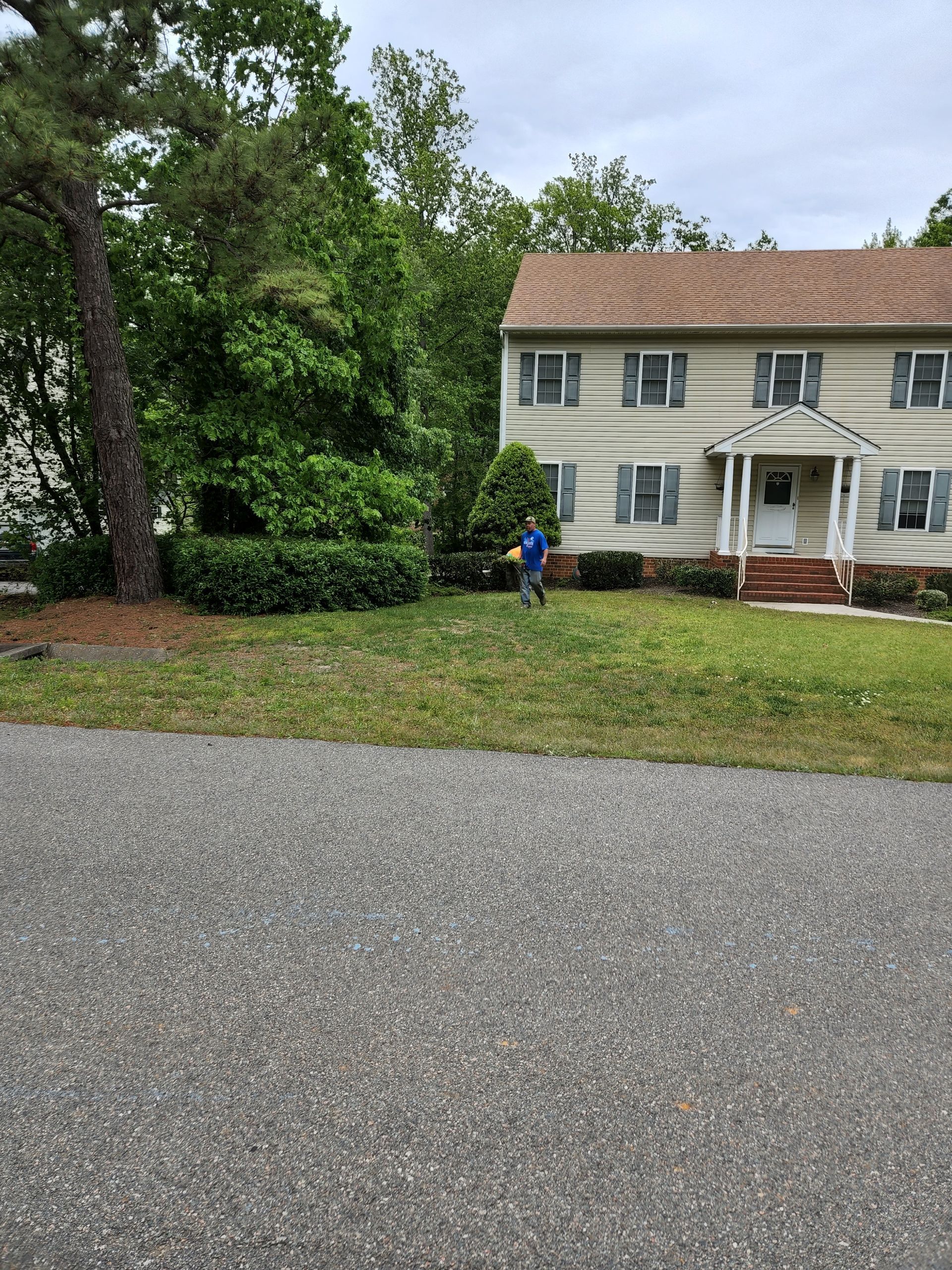Man Removing Grass — Hopewell, VA — T.A. Lawncare
