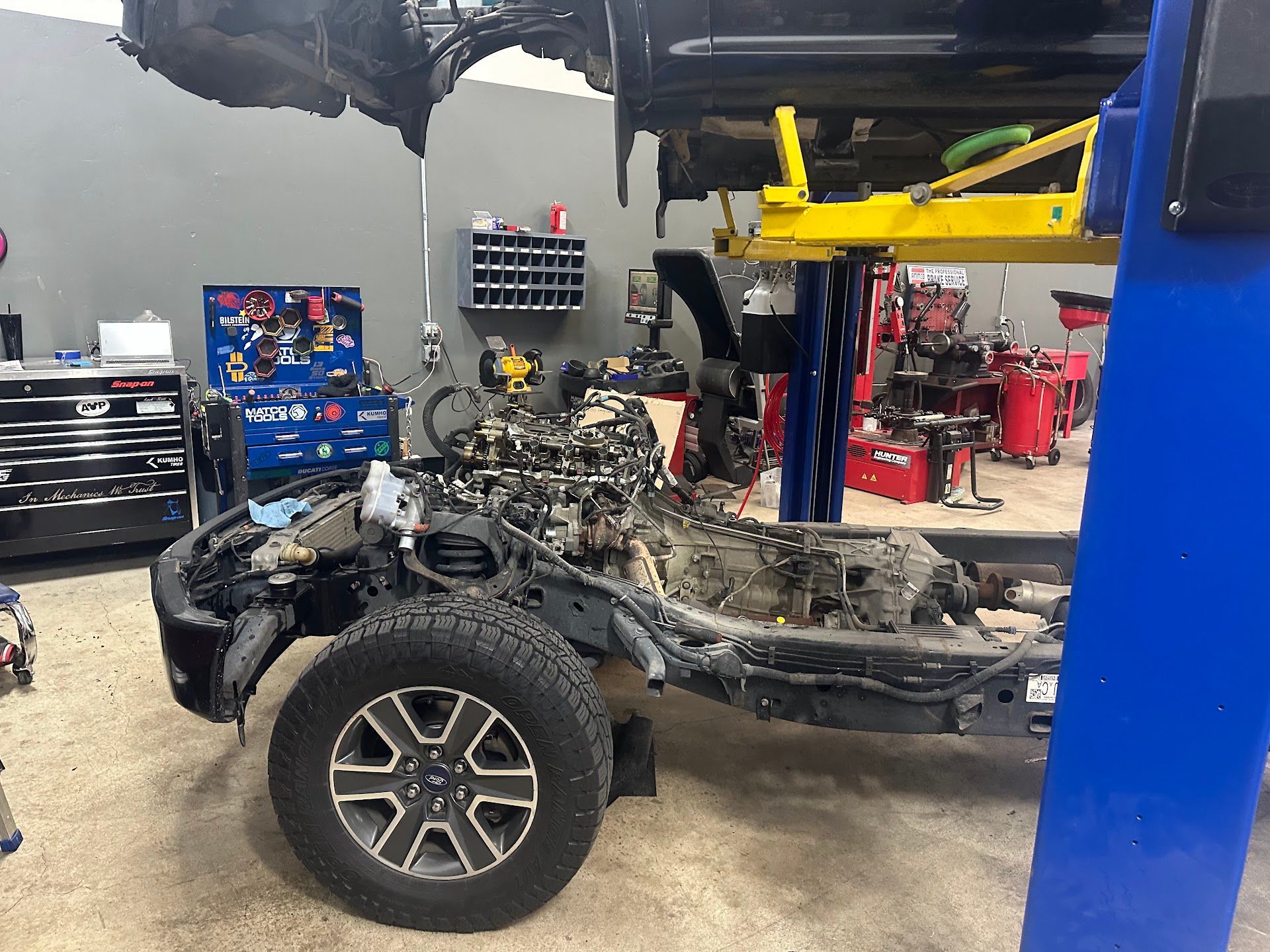 Vehicle Frame Disassembled On Lift During Engine Service | Immaculate Used Cars