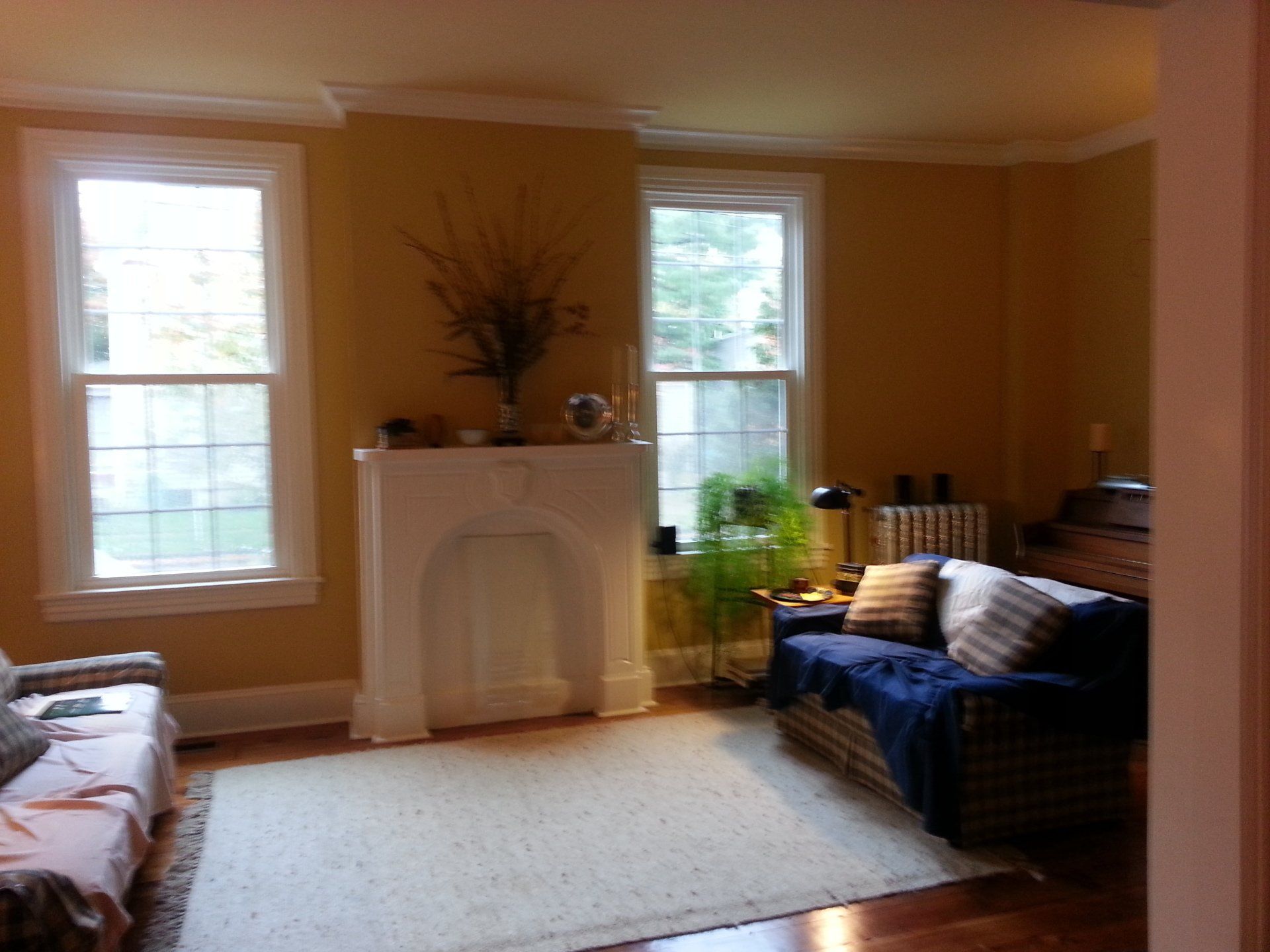 A living room with a fireplace and a couch