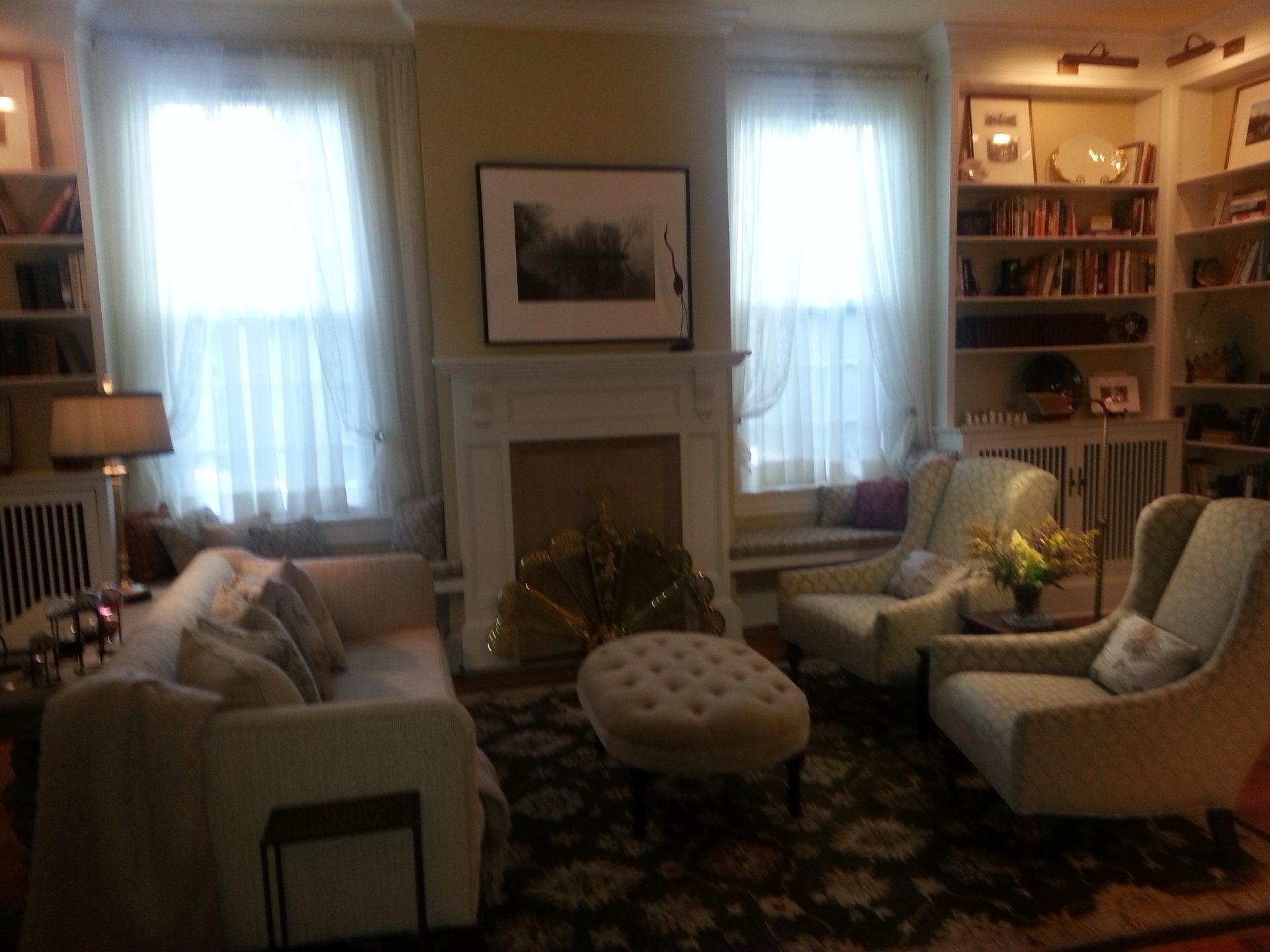 A living room filled with furniture and a fireplace