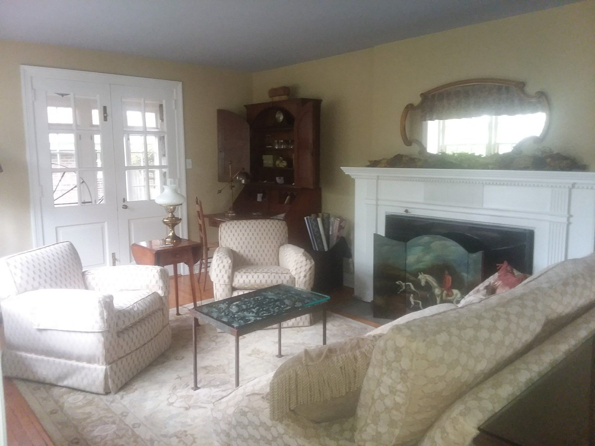 A living room filled with furniture and a fireplace