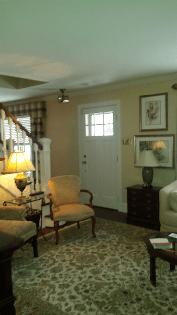 A living room with two chairs and a table