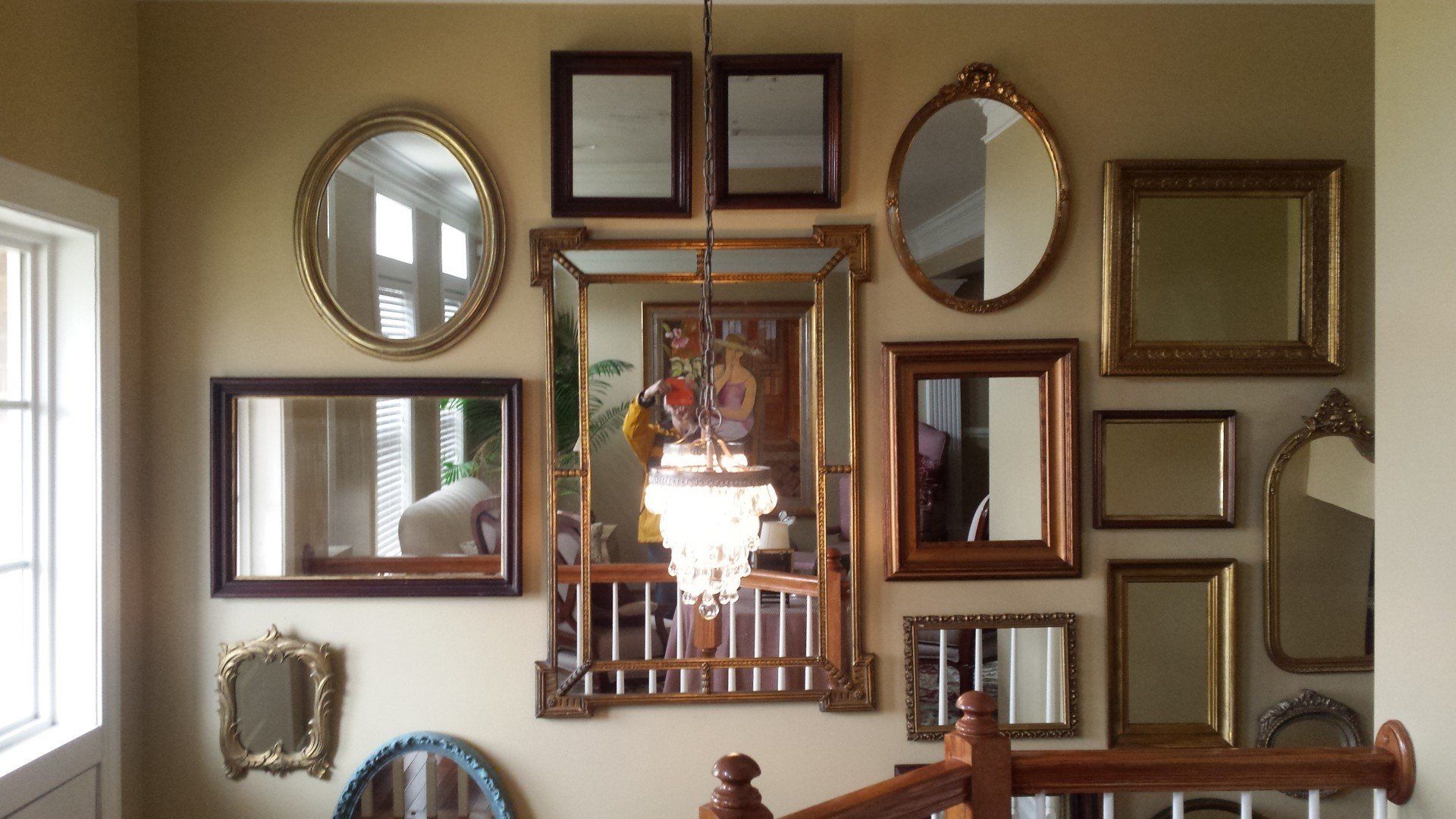 A wall with a lot of mirrors on it