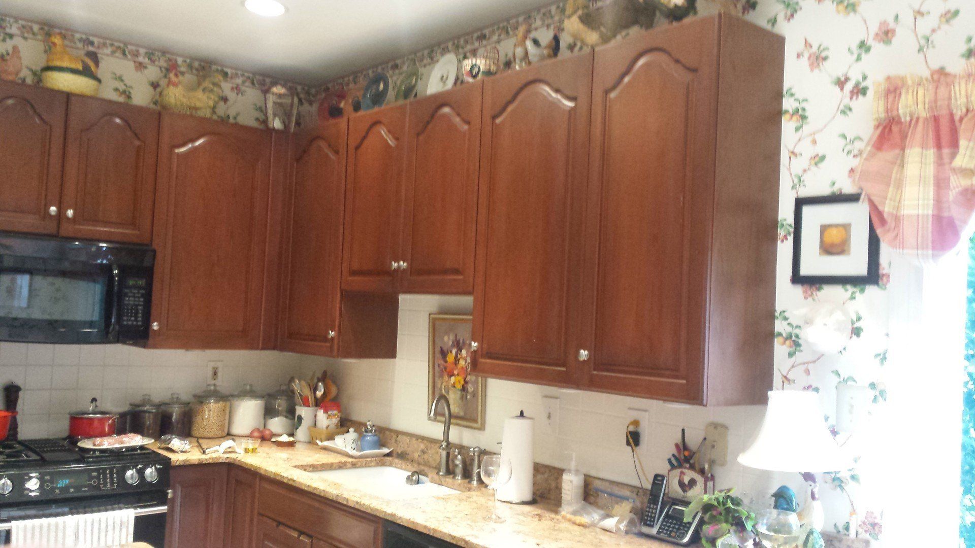 A kitchen with wooden cabinets and granite counter tops