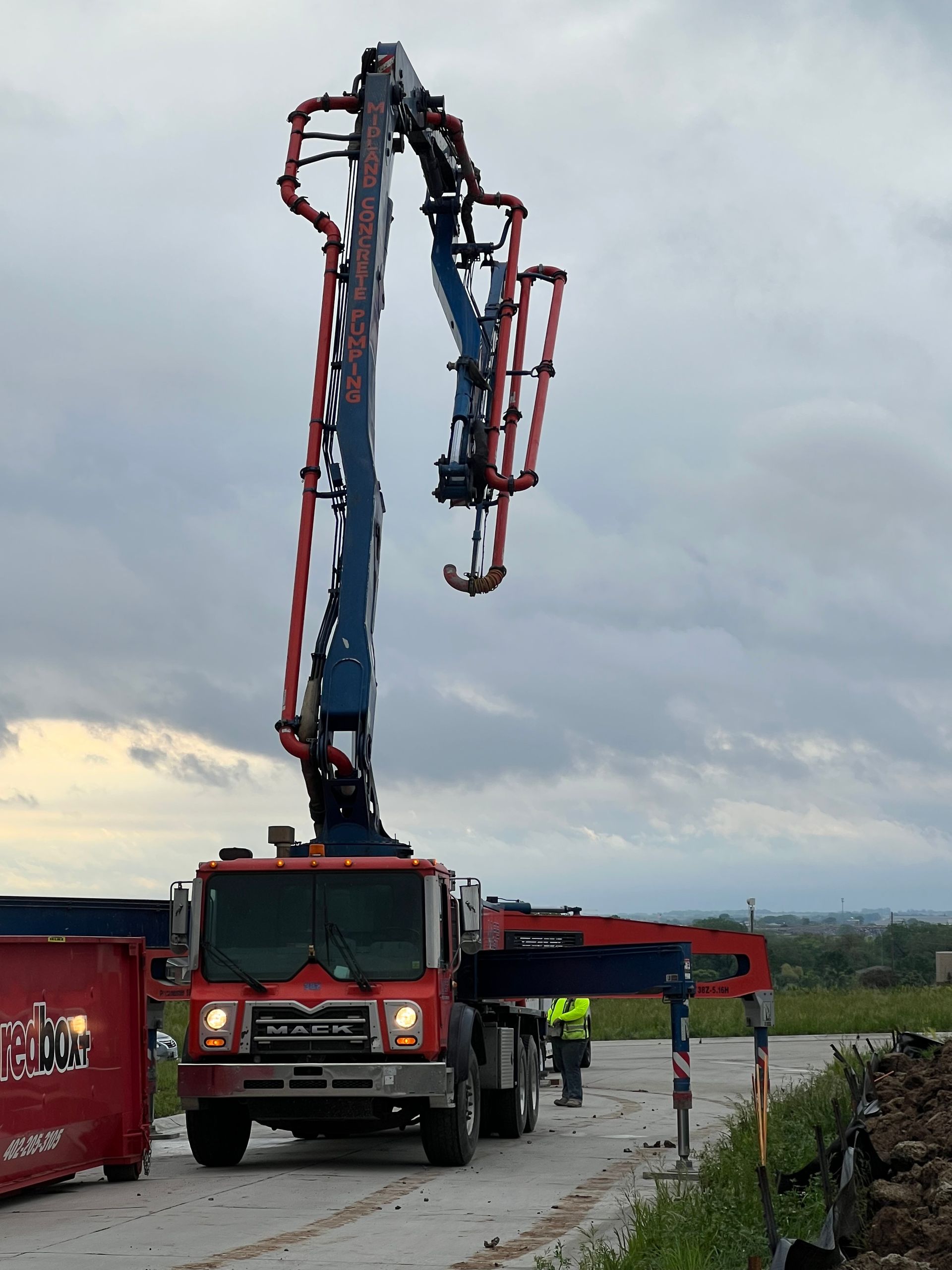 A man truck with a crane attached to it