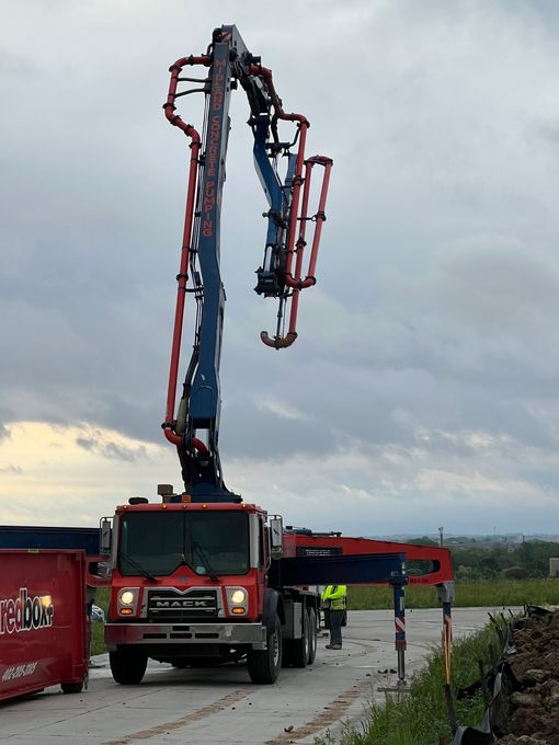 A man truck with a crane attached to it