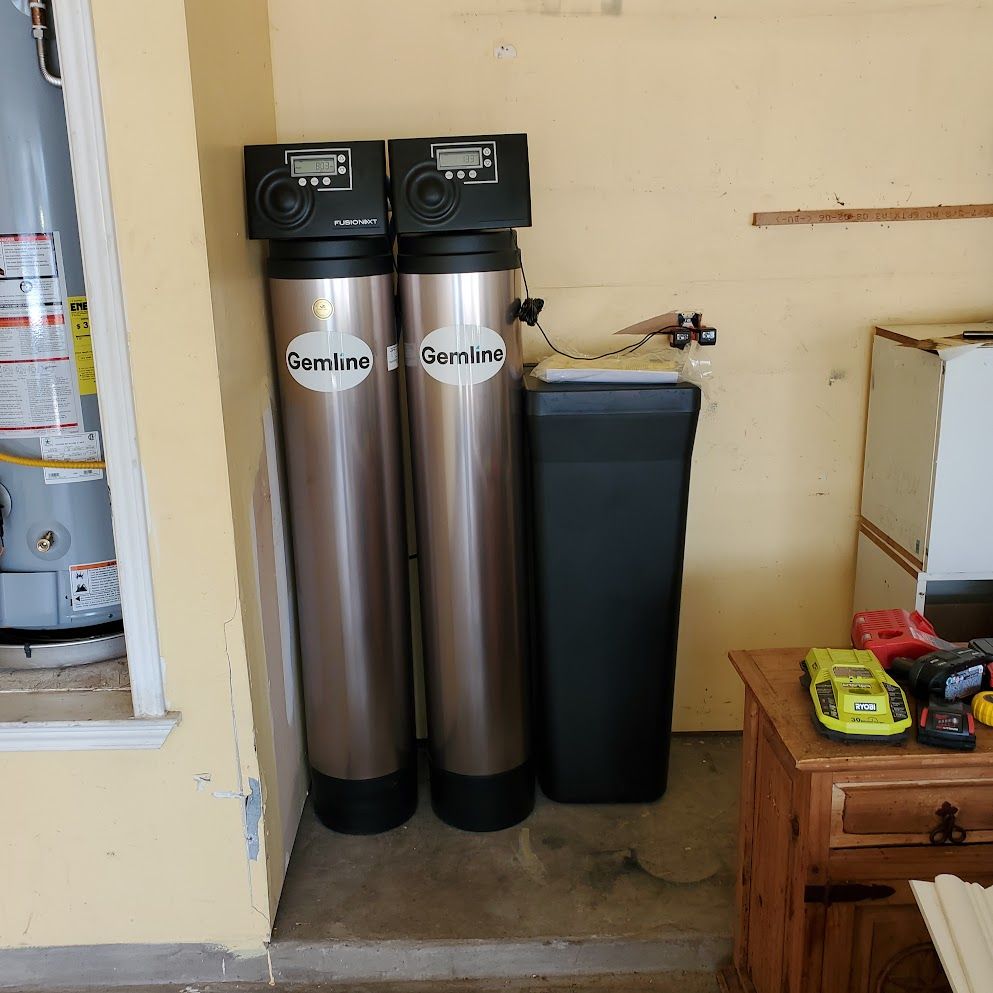 Two stainless steel water filters with the word gemline on them