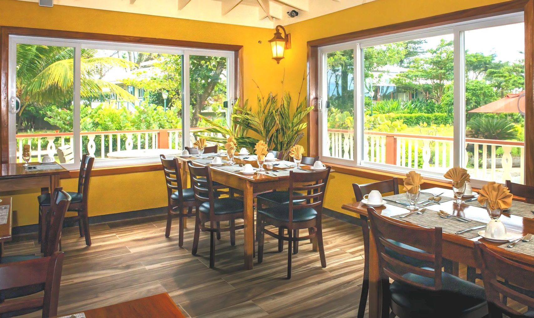 Indoor dining in our intimate, open-air setting or on the covered patio overlooking the Rosalie River and the Atlantic Ocean.