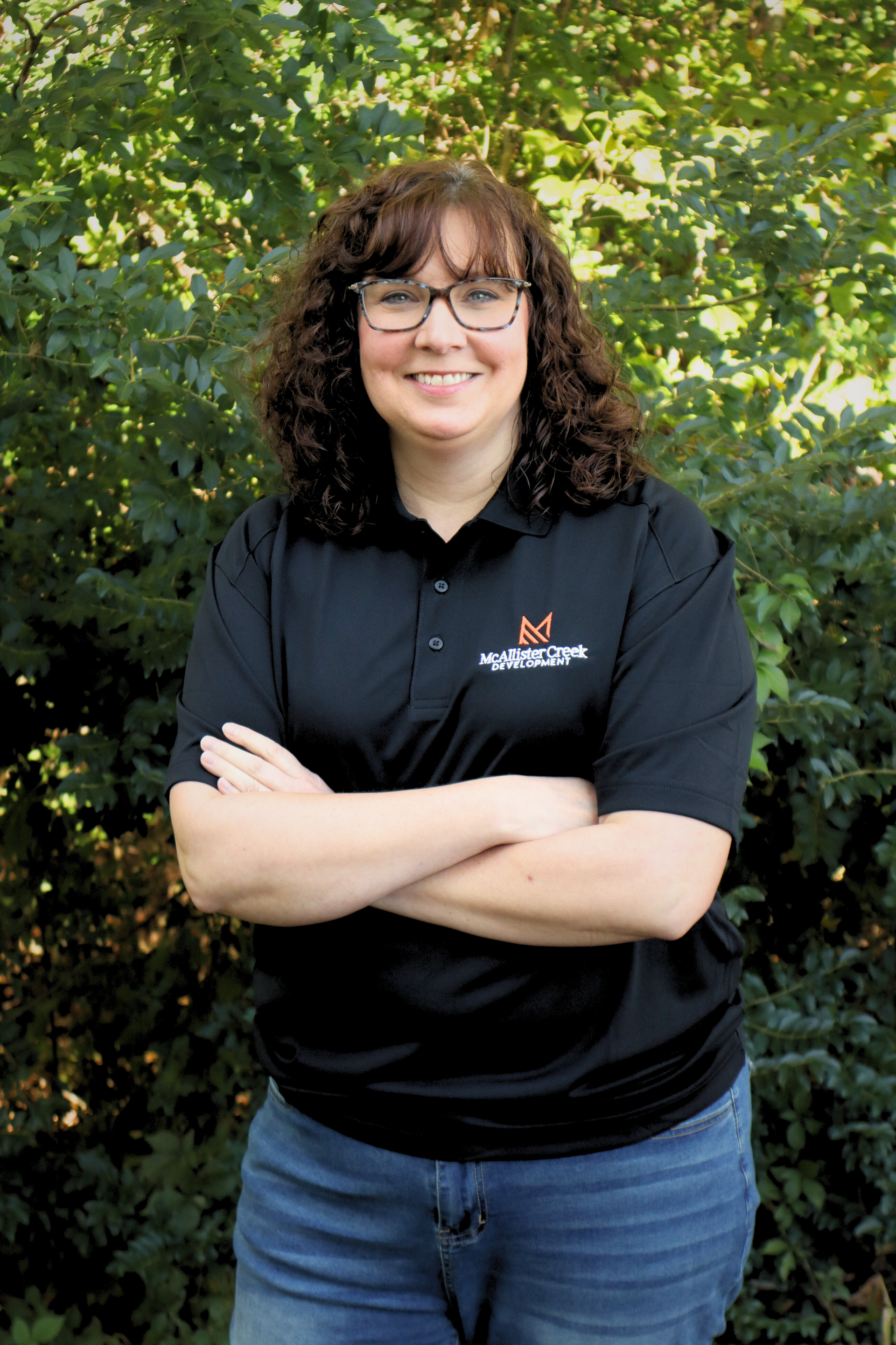 woman smiling with arms crossed