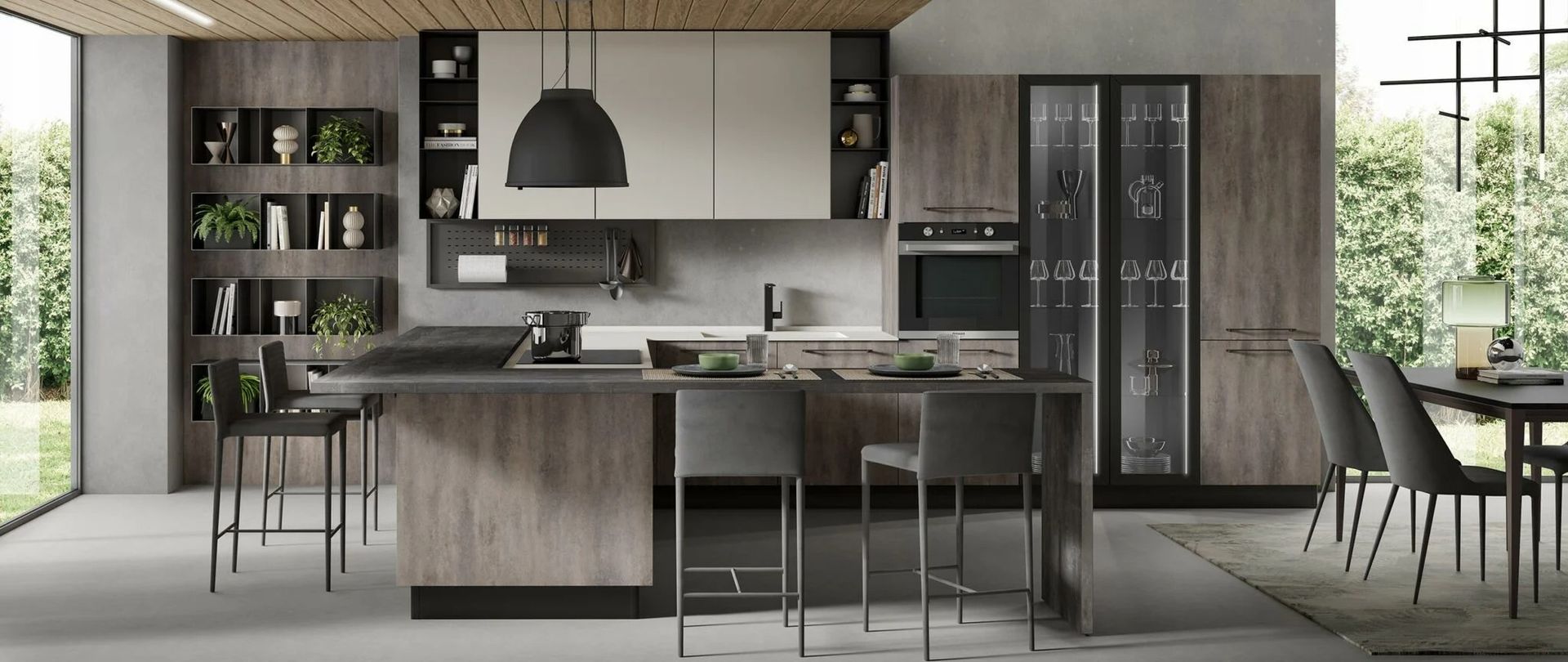 Una cucina con una grande isola, sgabelli, un tavolo e un frigorifero.