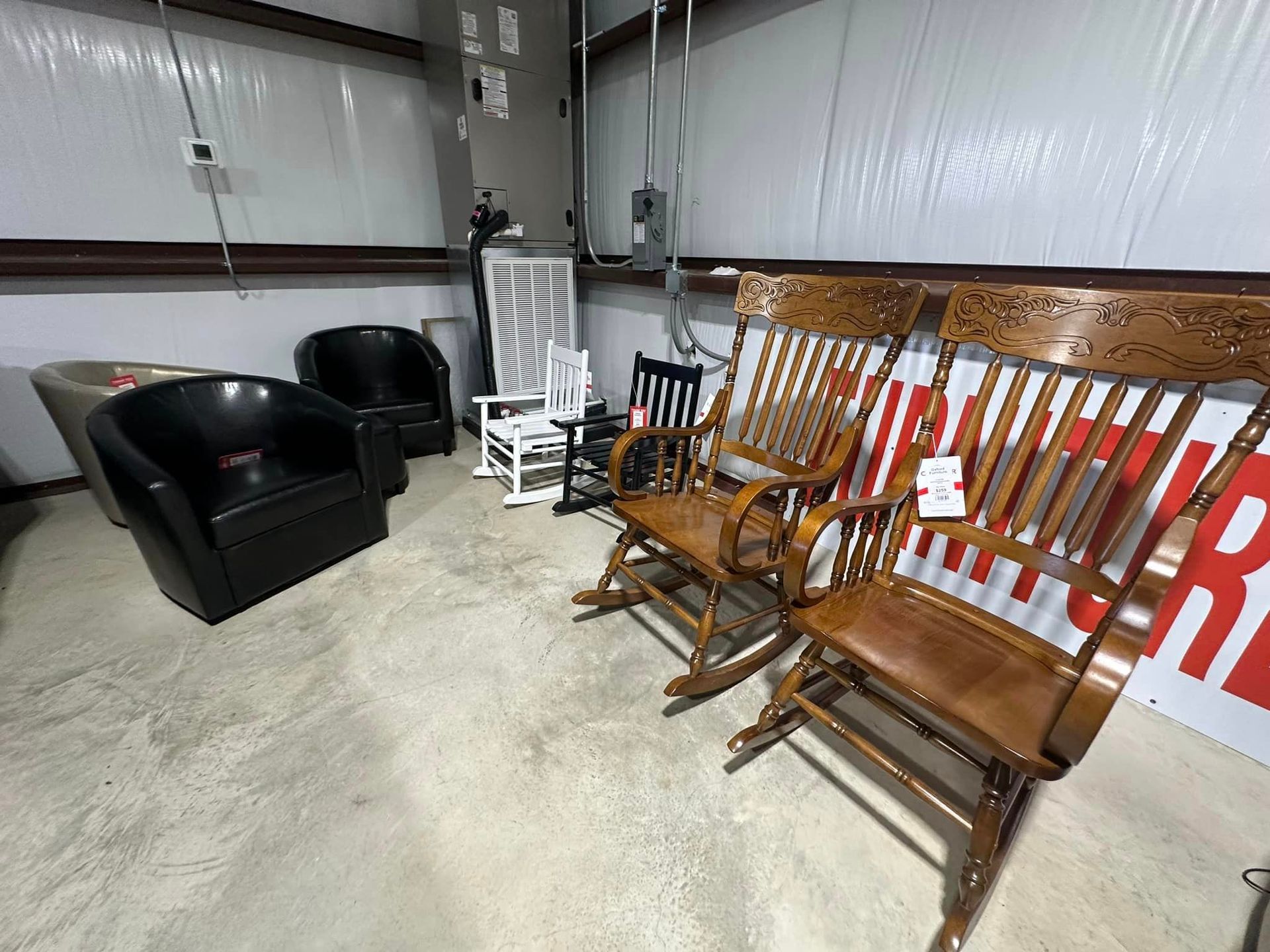 A room filled with rocking chairs and chairs.