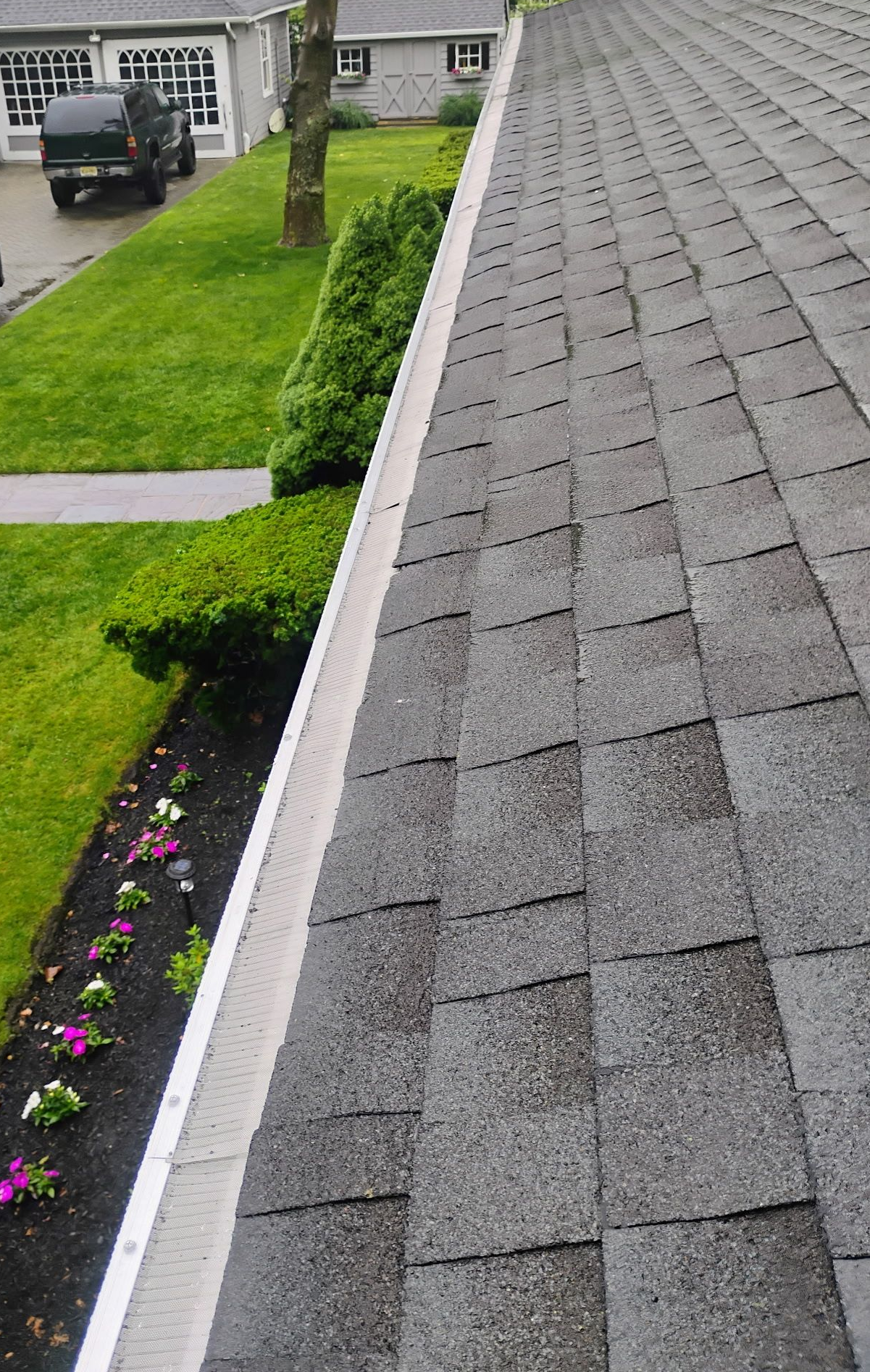 Asphalt shingle roof and gutter system on residential home in Monmouth and Ocean County NJ.
