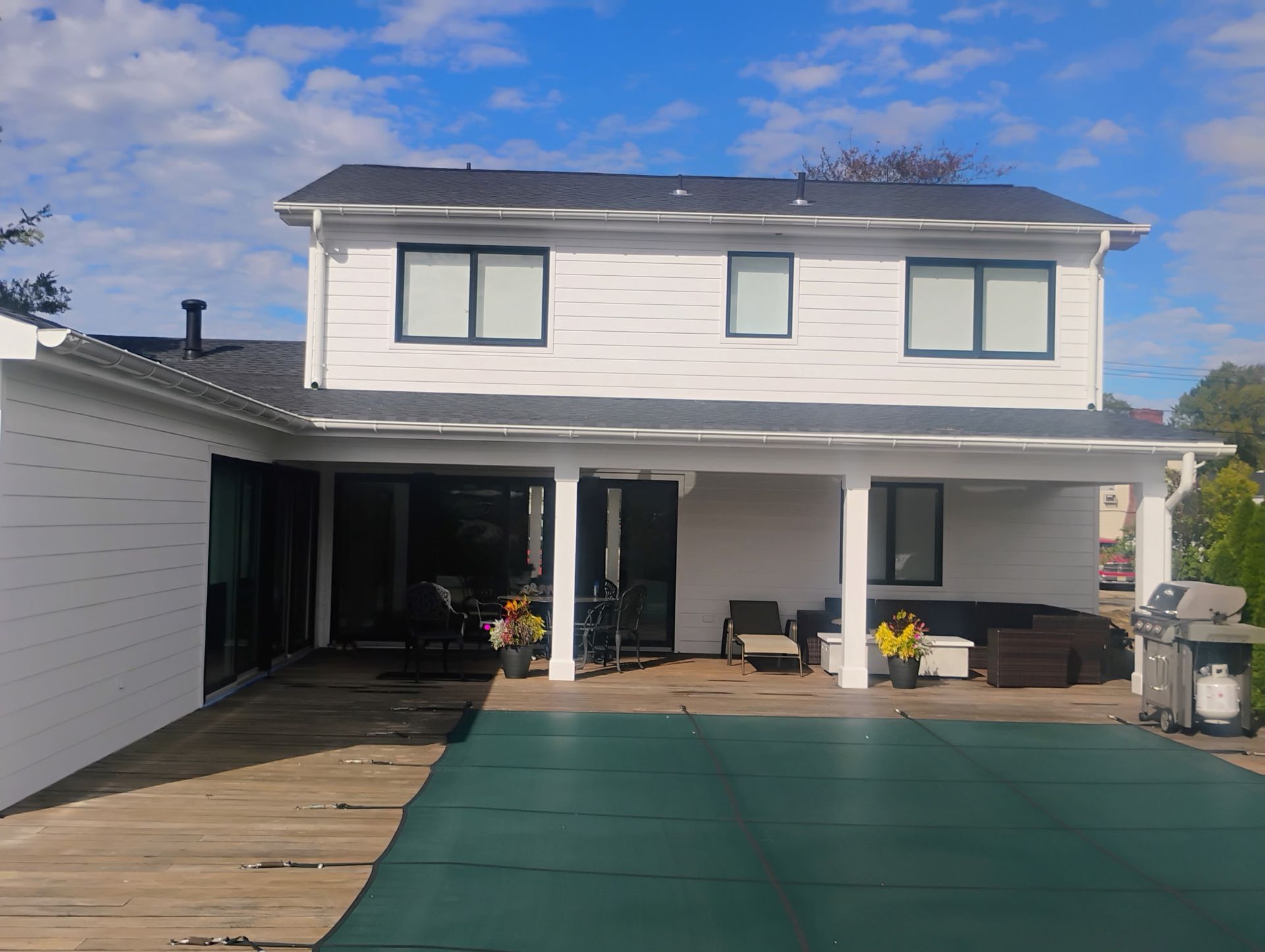 Two-story home with updated siding, roofing, and exterior renovations featured in our gallery.
